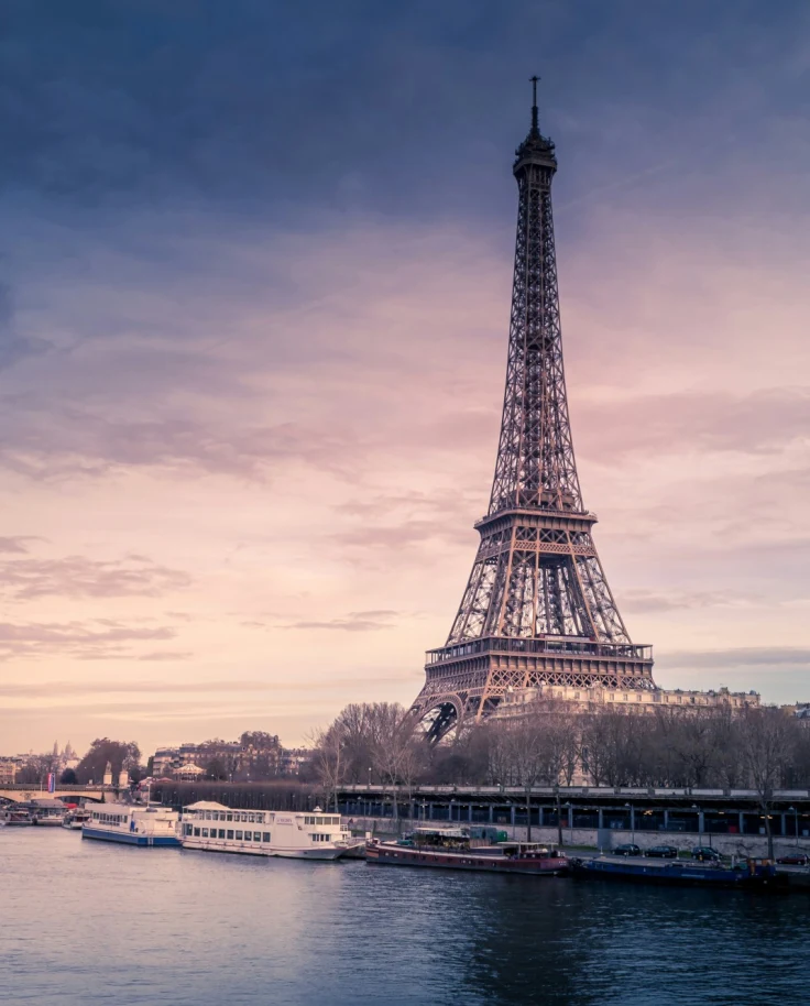 A view of the Eiffel Tower at sunset after traveling from Zurich to Paris.