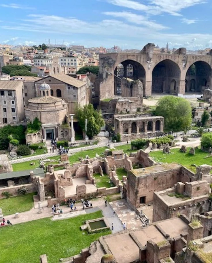 A Sorrento to Rome trip includes seeing these ruins, which are surrounded by grass and trees - Janelle Smith