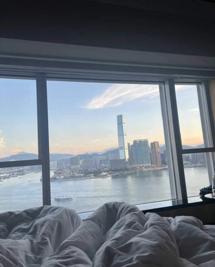 A view of Hong Kong as the sun rises from a hotel window.