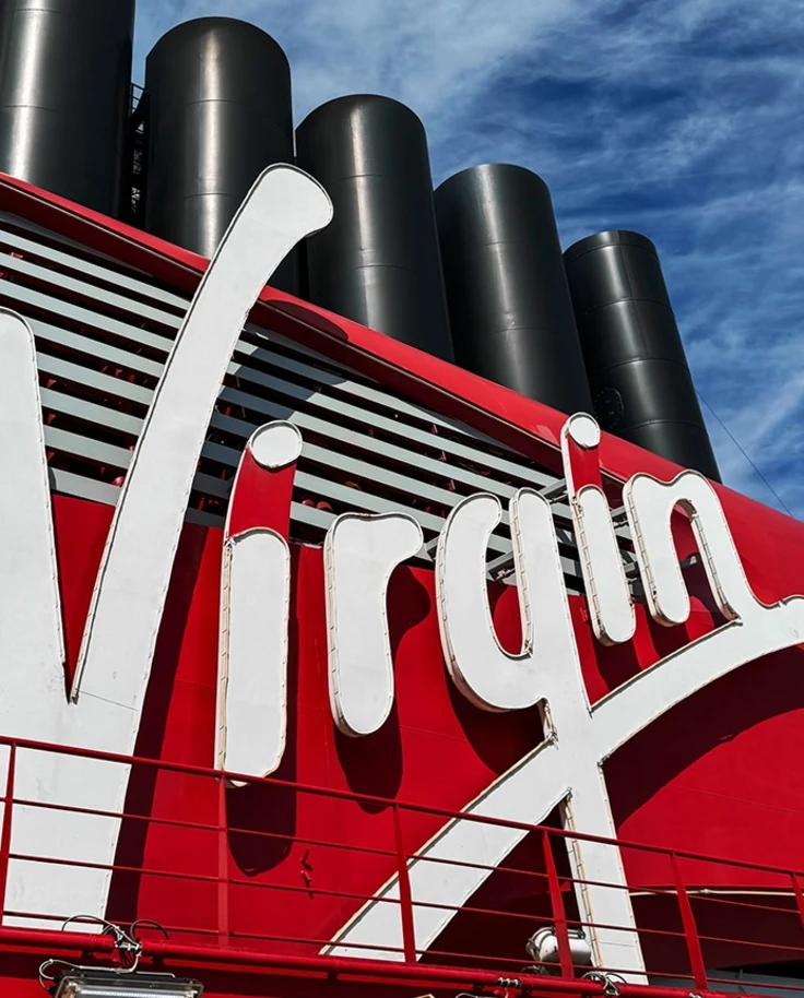 The word "Virgin" in white lettering against a red background