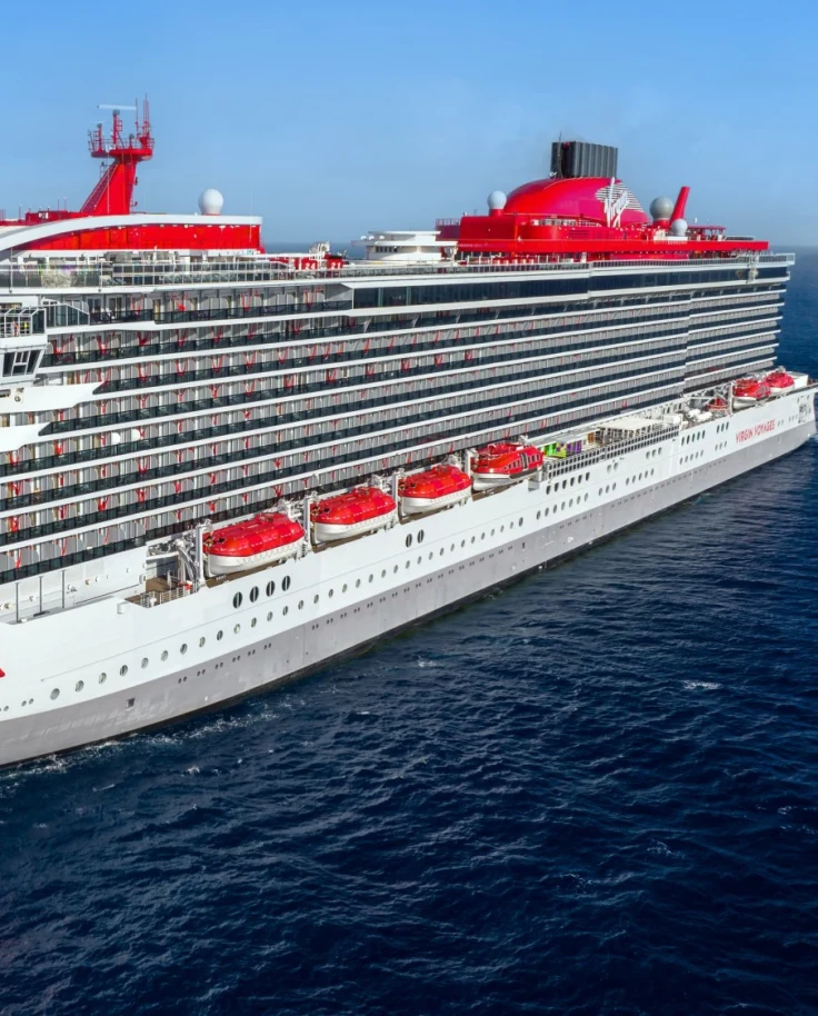 Virgin Voyages Cruise Ship on the water on a sunny day.