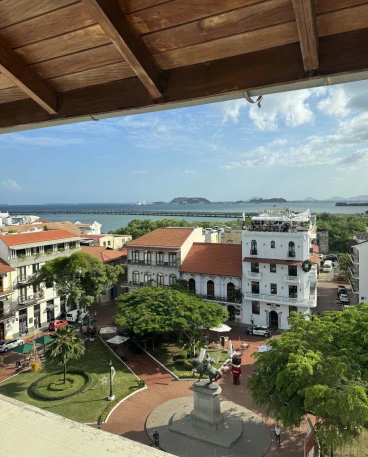 View from the hotel balcony with a beautiful courtyard and lots of foliage in the surrounding areas.
