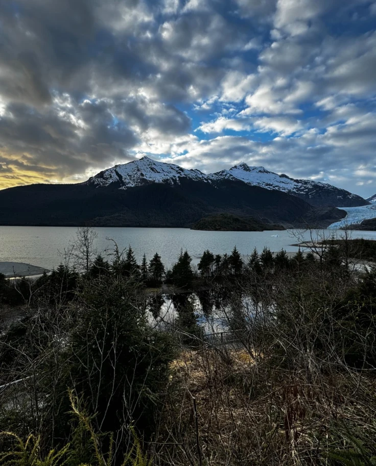 Lake and trees with glacier in the background.