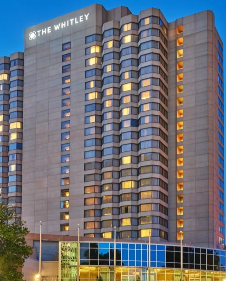 A tall hotel skyscraper that says The Whitley at the top.