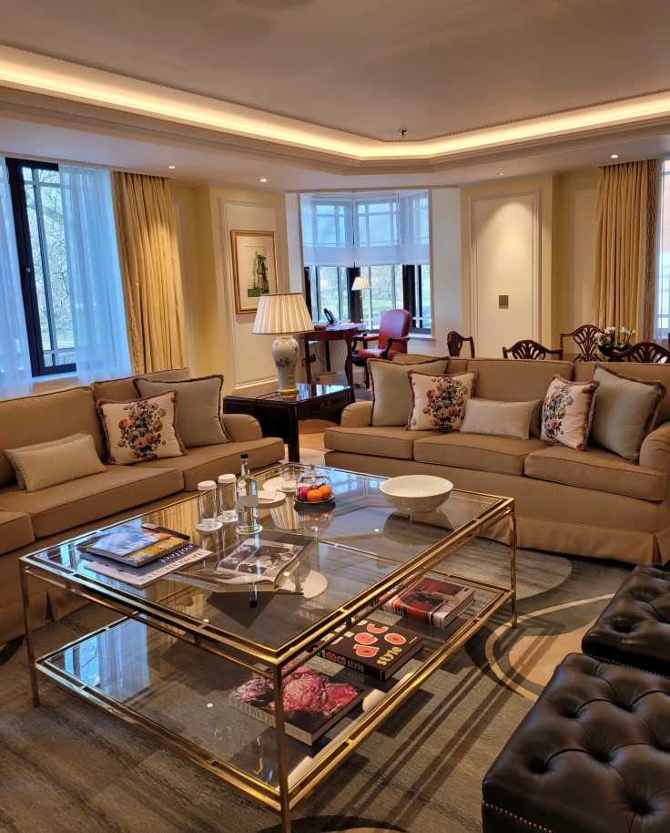 The lobby of a hotel with two large sofas