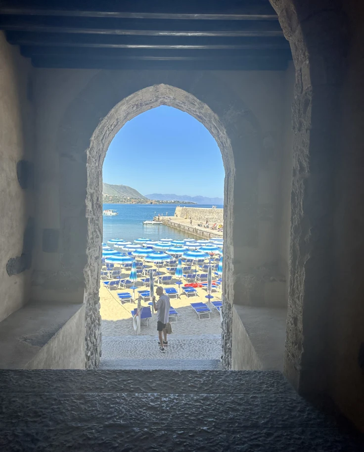 Window looking out on to the ocean.