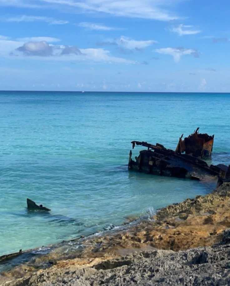 View of the ocean with scrap metal in the foreground.