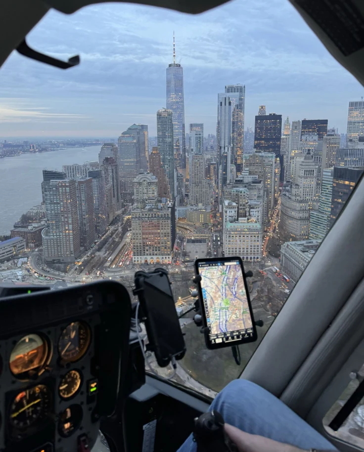 A helicopter view of New York City in the evening.