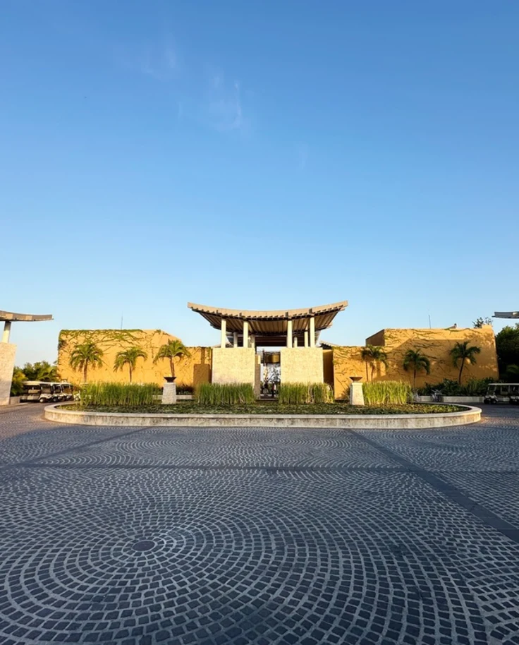 An exterior shot of a Zen sand garden with rake lines.