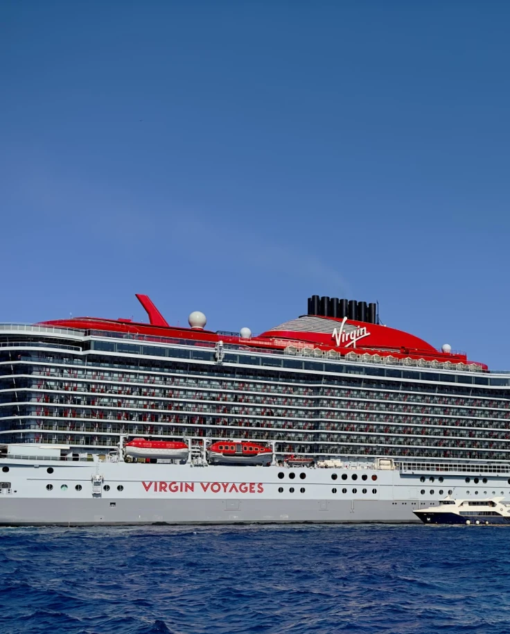 White and red cruise ship in the water