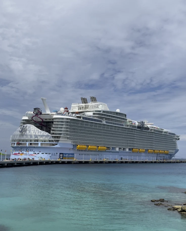 A view of a large cruise ship, Utopia of the Seas at Perfect Day at CocoCay