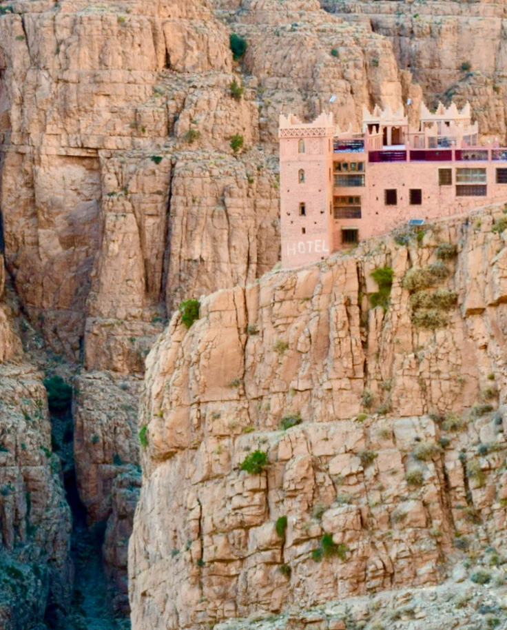 A hotel perched on a beautiful mountain scape.