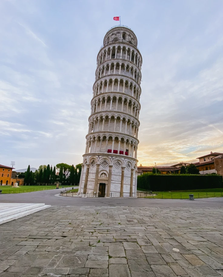 A low-angled shot of the famous Pisa Tower, taken during daytime.