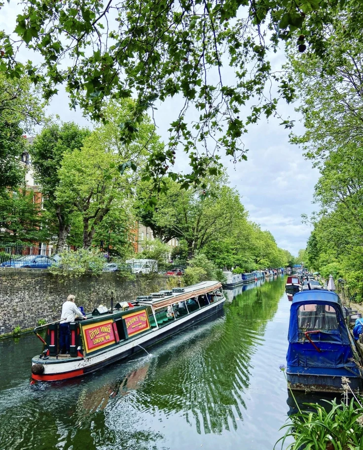 Longboats on a canal during the daytime