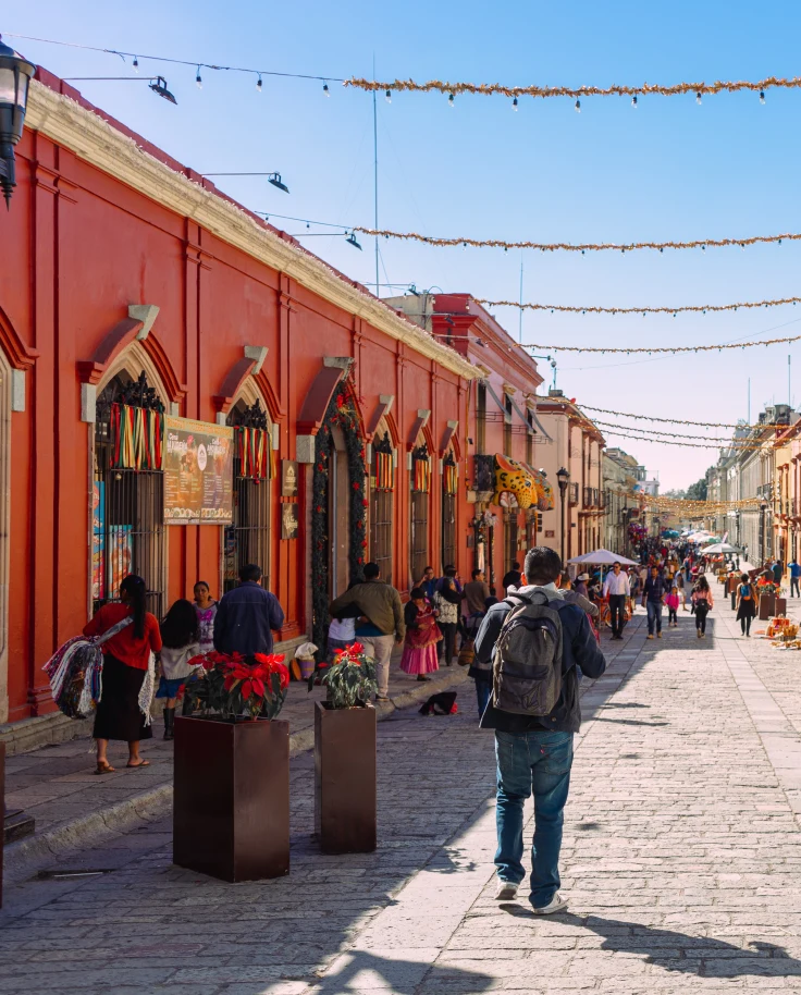 A street wise with coral-colored buildings.
