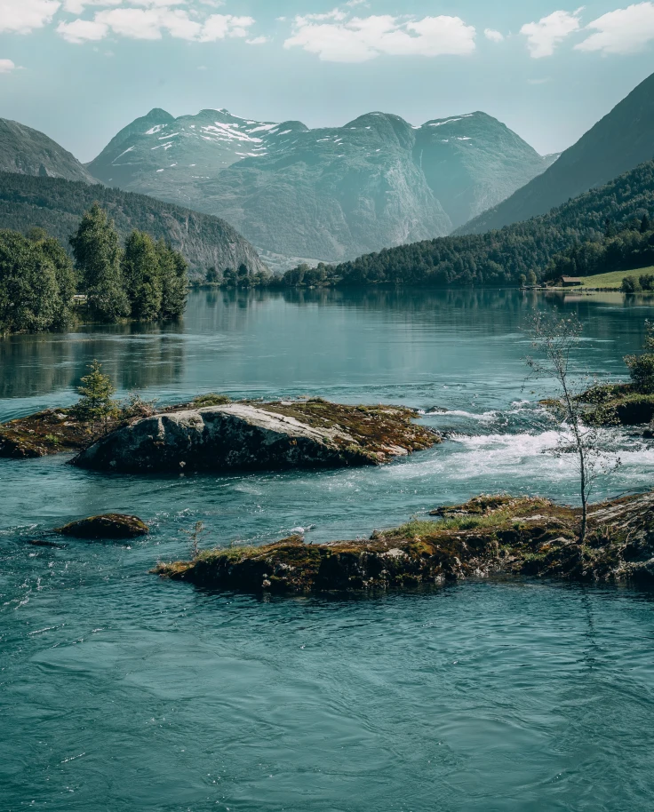 A view of water with mountains in the background in Norway.