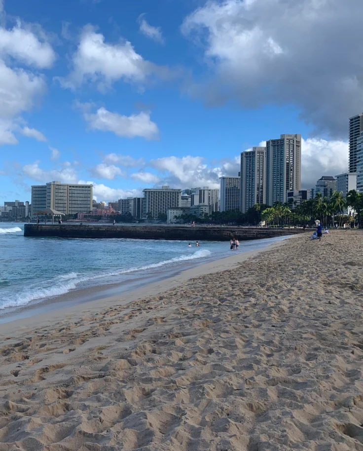 A far view of the beach near the city during daytime.