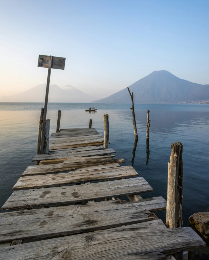 A wooden dock at the water of Lake Atitlan.