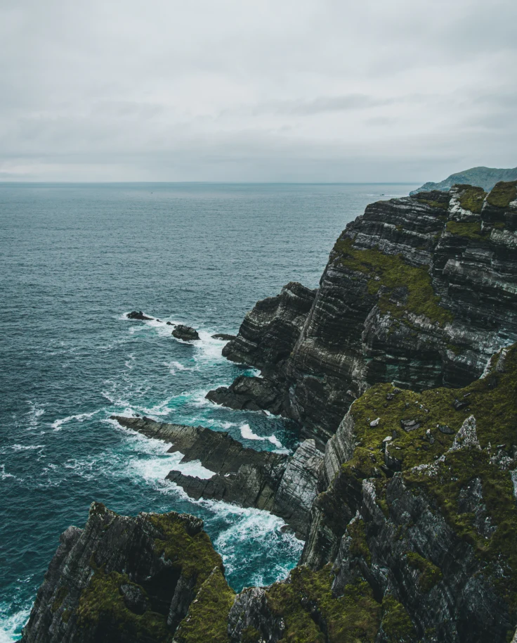 A rugged coast at sea.