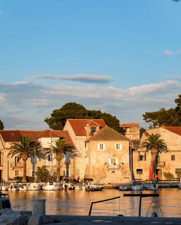 buildings with golden hour sun and harbor