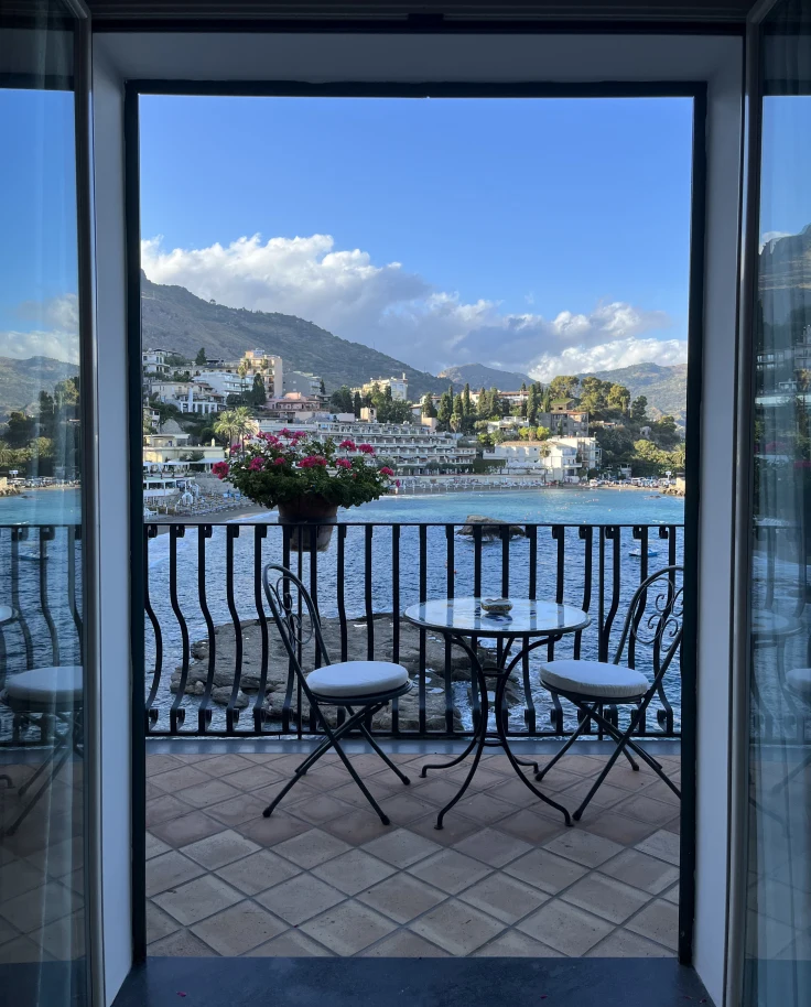 Balcony of a hotel looking out on a body of water