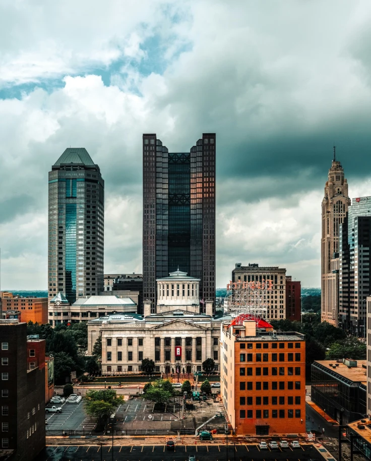 A view of the city skyline with thick clouds above.