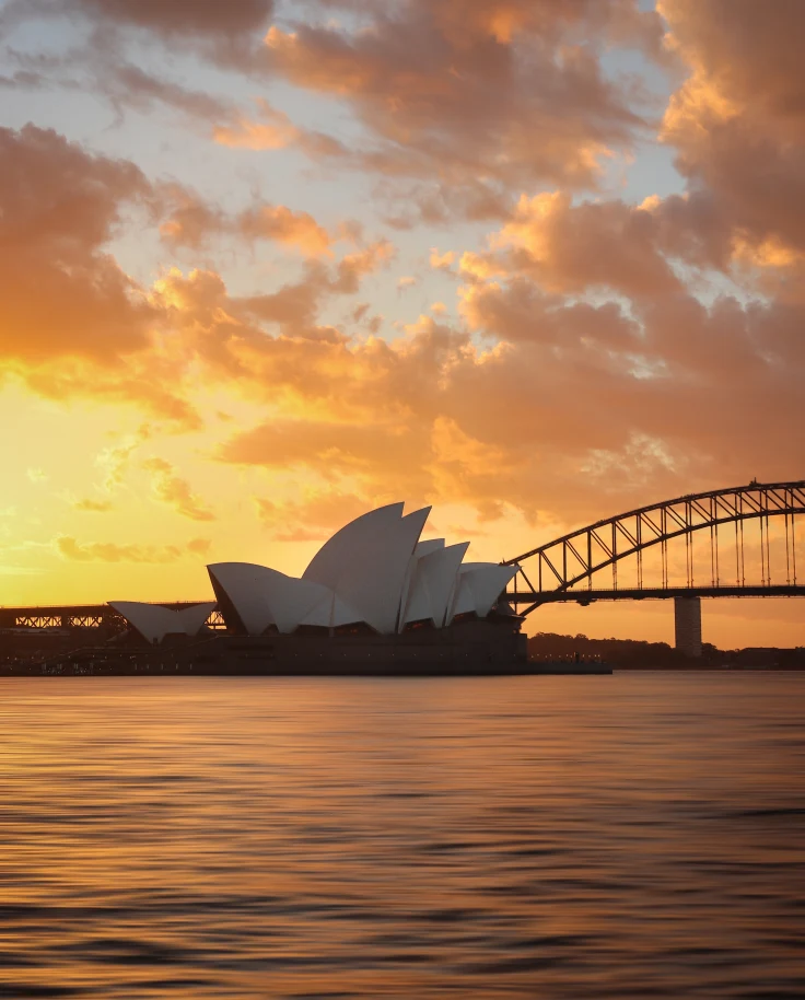 A picture of the Sydney Opera House at sunset.