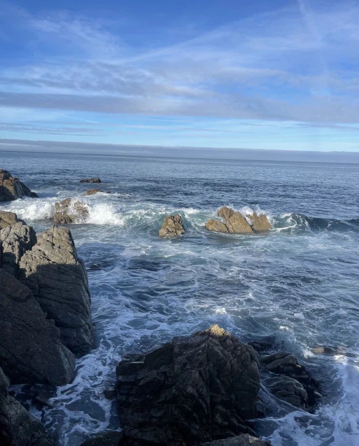 View of a bay of water with large rocks