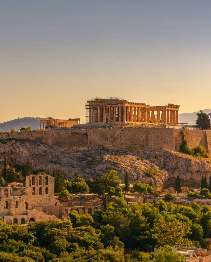 Ancient Greek ruins in Athens set atop a hill taken during the day