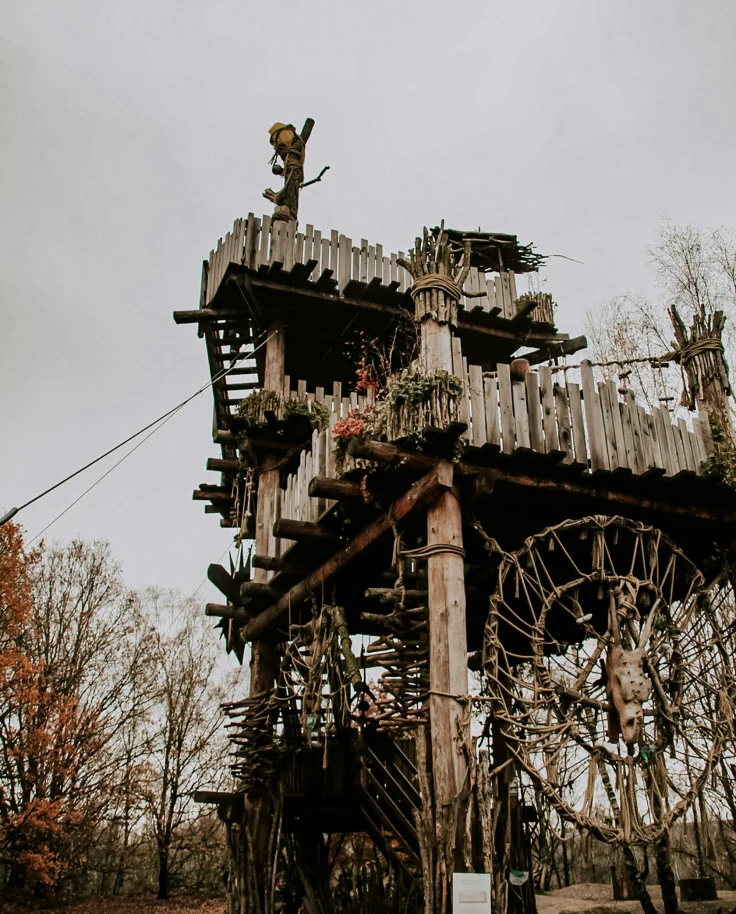 Brown wooden tower with cross on top