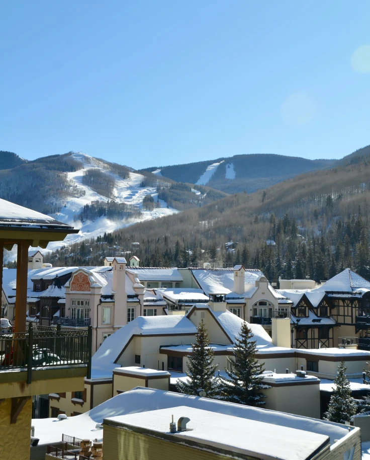 buildings with mountains in the background during daytime
