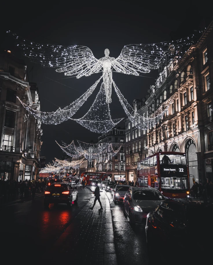 bright lights hanging over city street at night