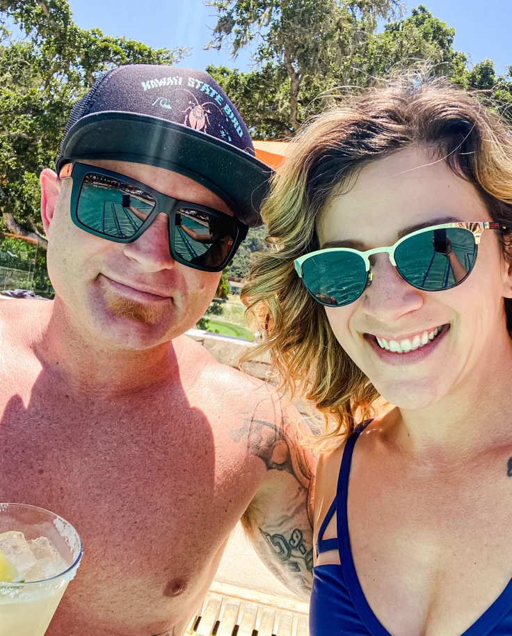 Two people posing in front of the camera