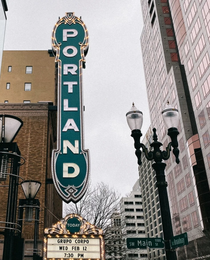 vertical green sign that reads "Portland"