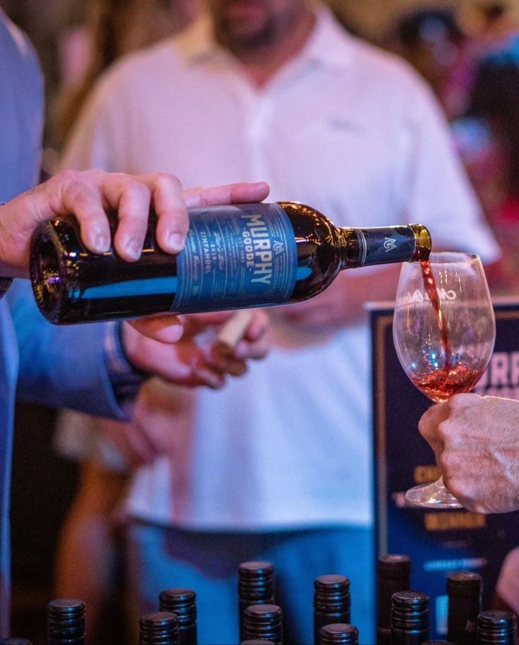 Wine being poured in a glass for wine tasting.
