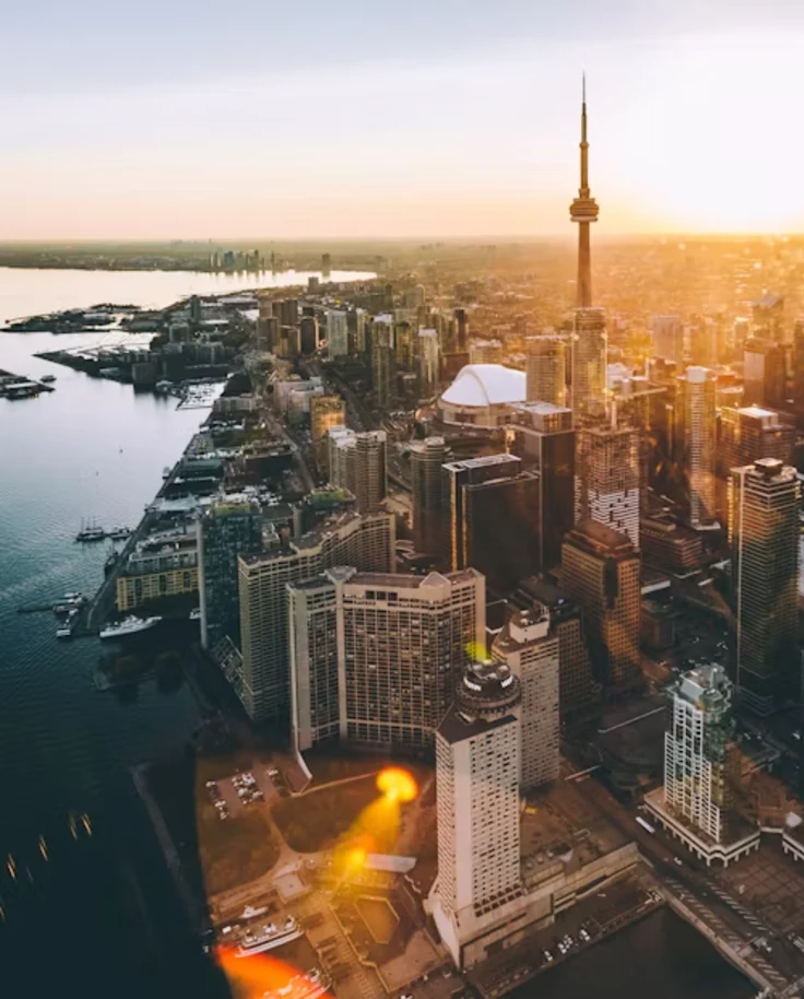 Aerial view of Toronto city skyline during orange hour.