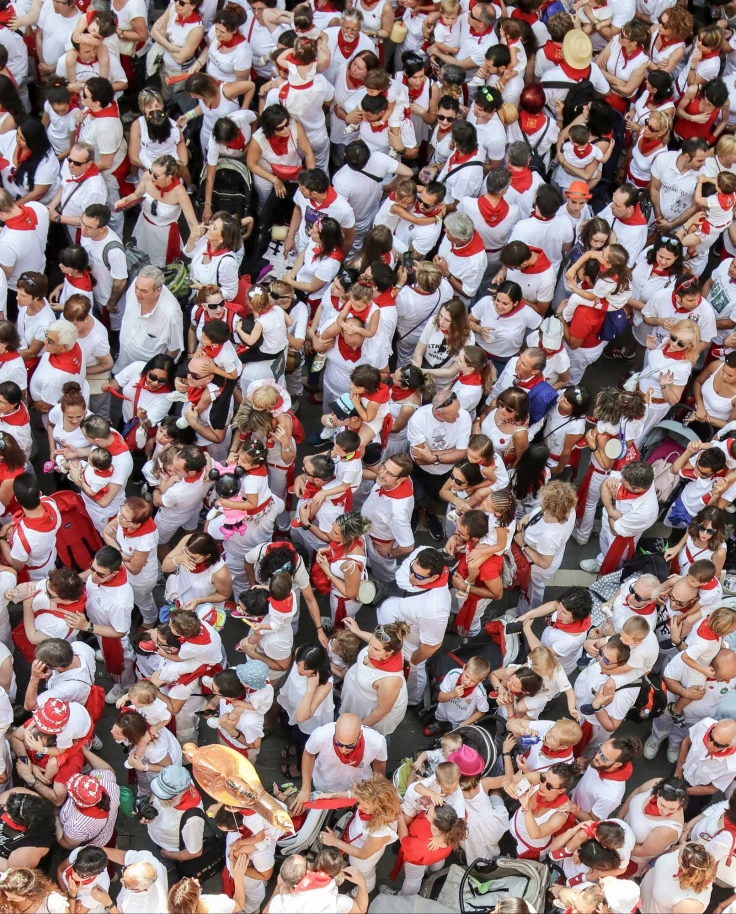 An aerial view of the people standing in a crowd for running of the bulls.