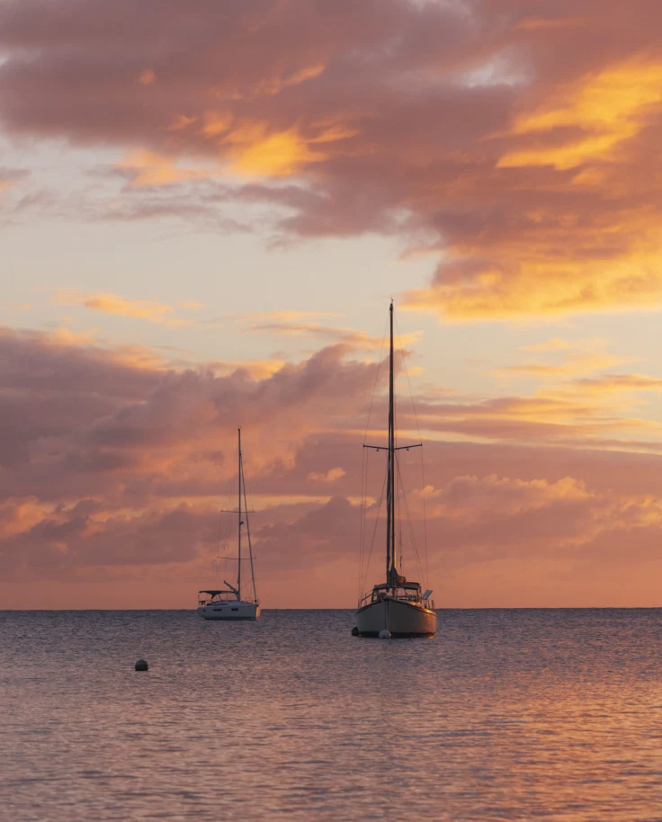 A couple of boats on a body of water.