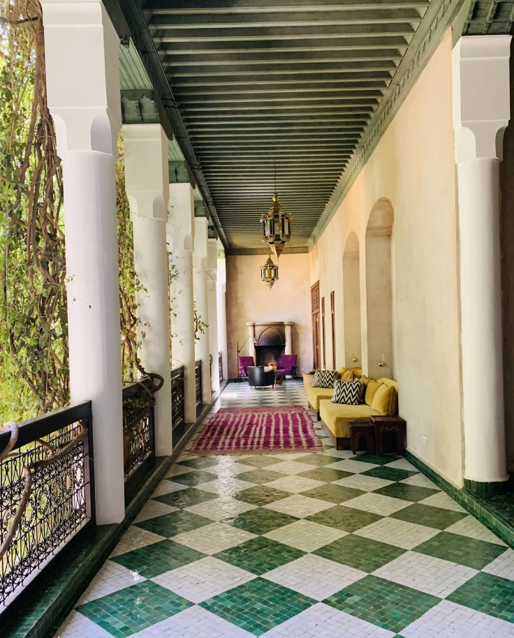 sunny colonnade with a green-and-white checkered floor