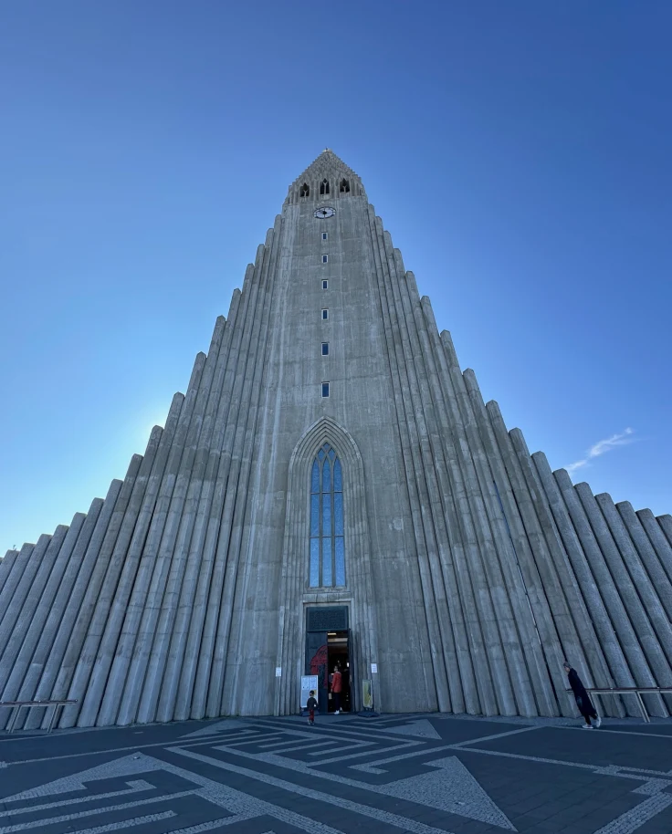 A towering cathedral set against a blue sky during the daytime