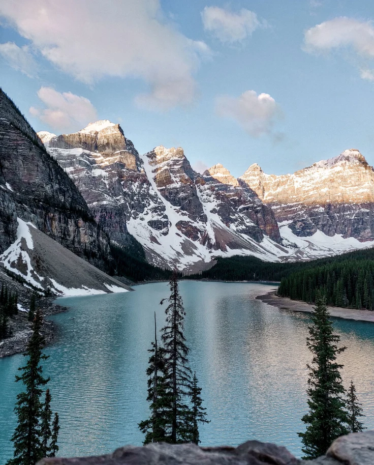 snow mountains over a blue lake in winter