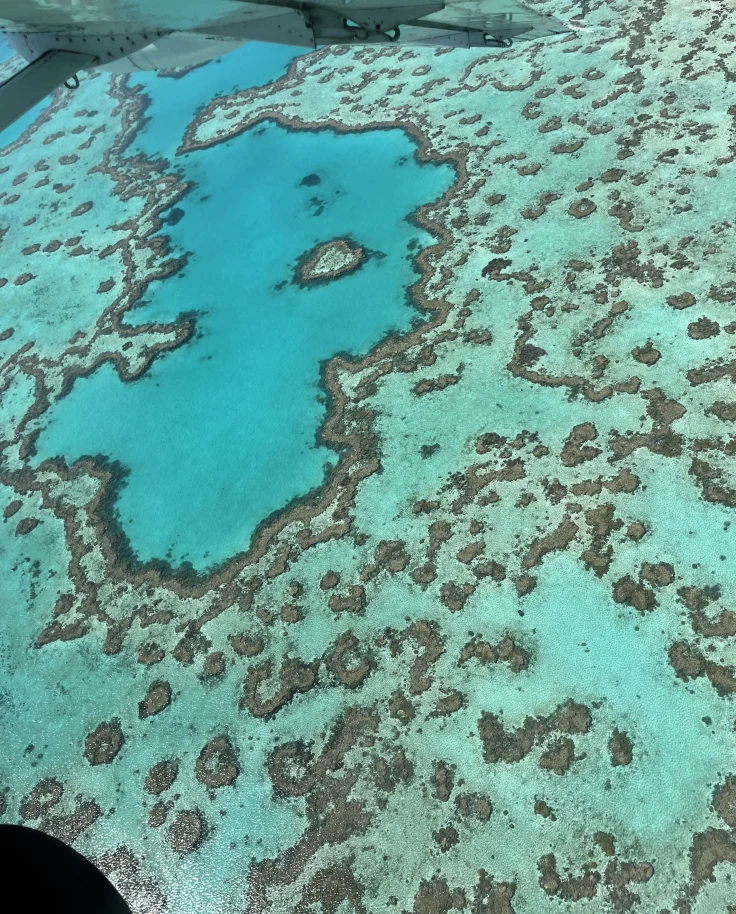 Areal view of an Island with bright blue water