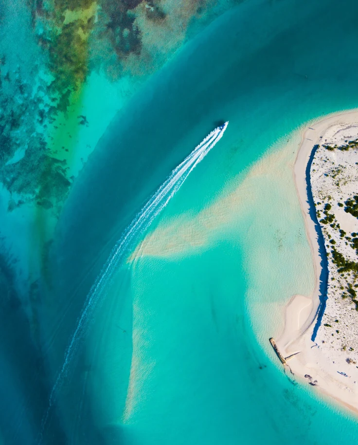 Aerial view of sea with a boat.