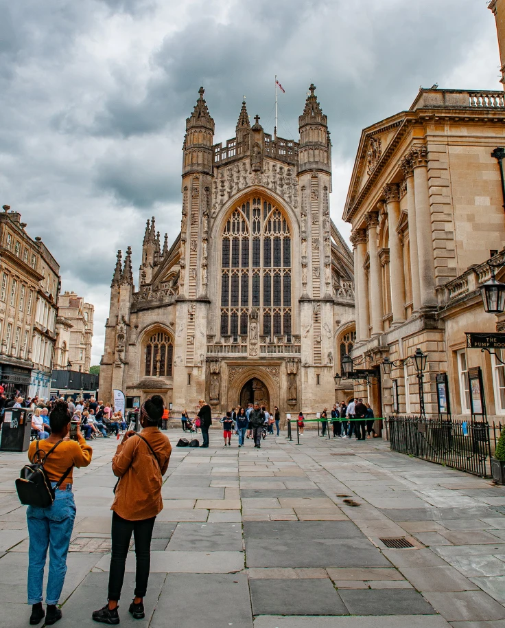 people standing in front of large building during daytime