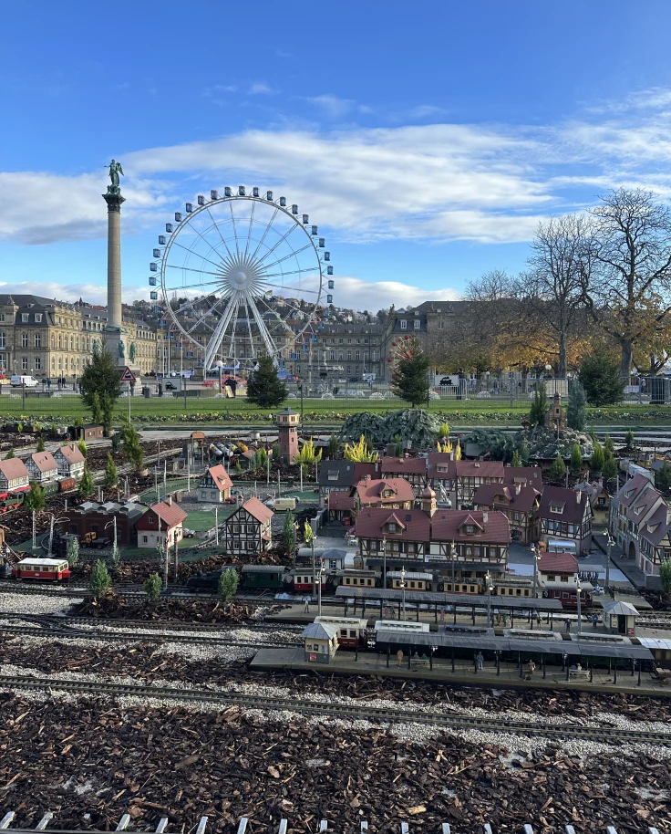 A miniature town model with a ferris wheel