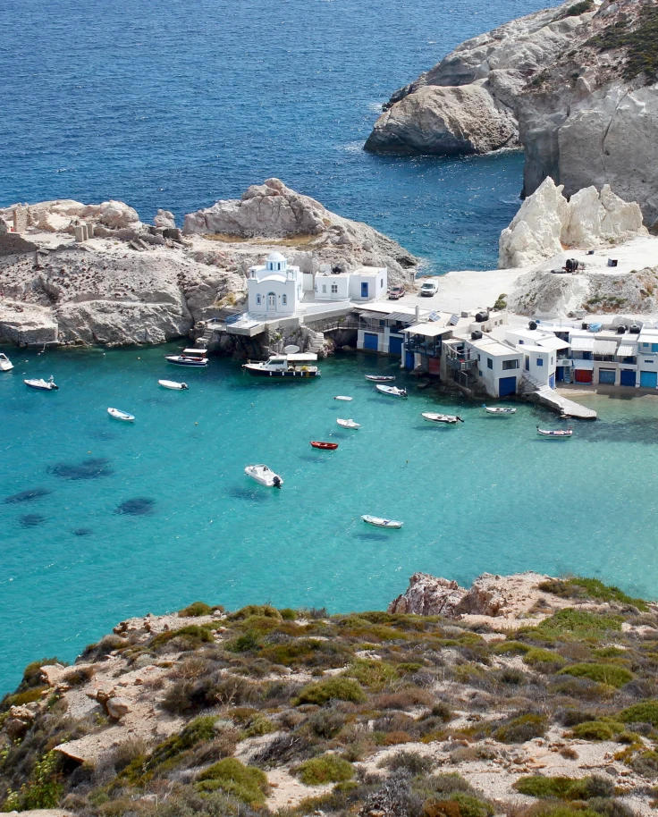 aerial view of body of water and cliffs