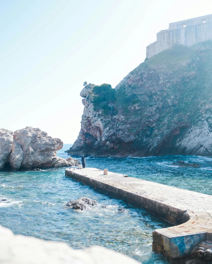 A long harbor in the water between cliffs during the daytime