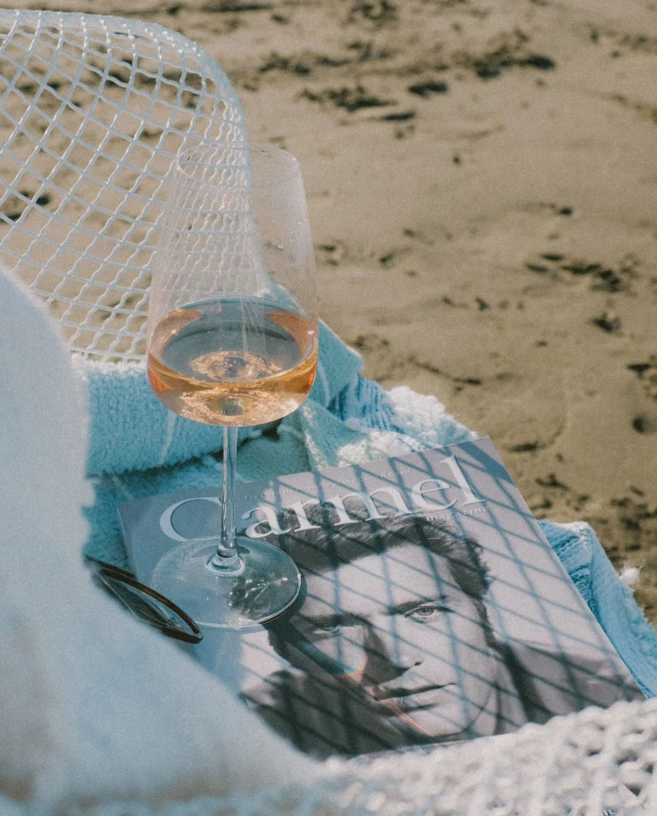 A magazine cover and a glass of champagne.