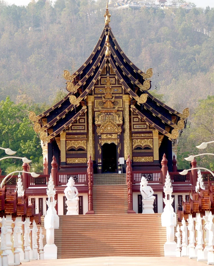 View of a large and intricate black and gold building