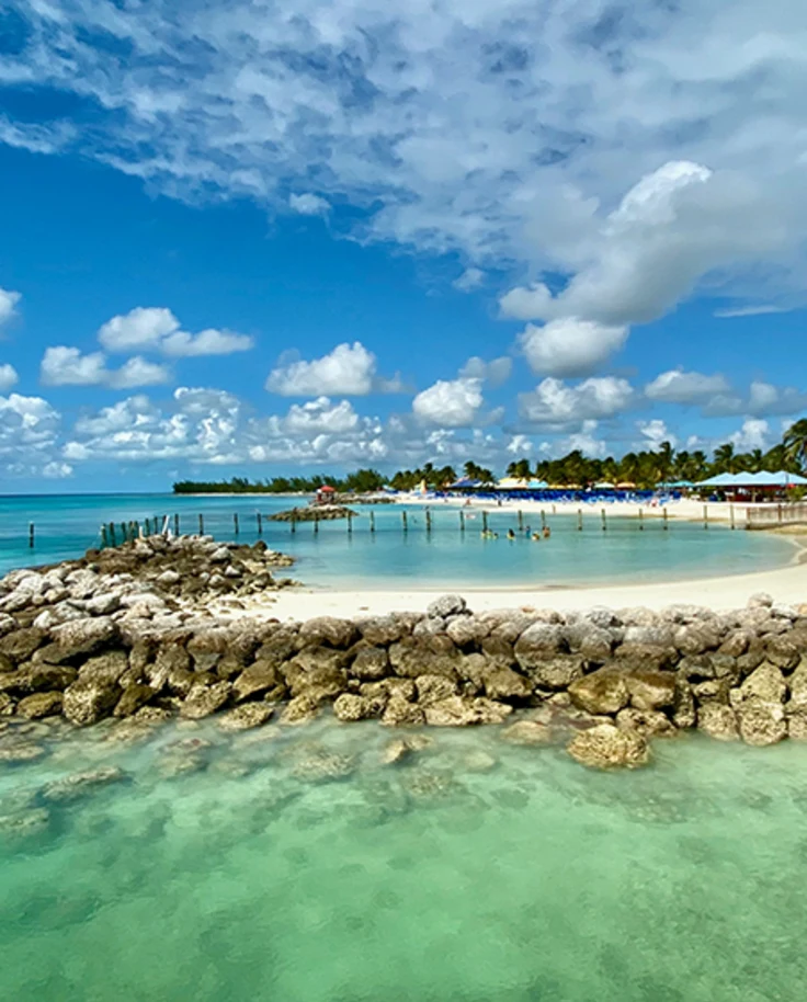 White sand beach with cabanas In Harbor Island, Bahamas.